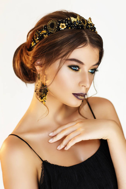 Portrait of gorgeous young woman in beautiful earrings  - Zdjęcie, obraz