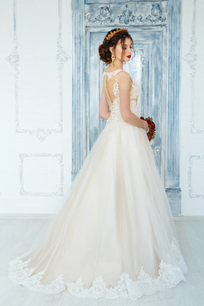 Gorgeous young woman in elegant wedding dress  - Фото, изображение