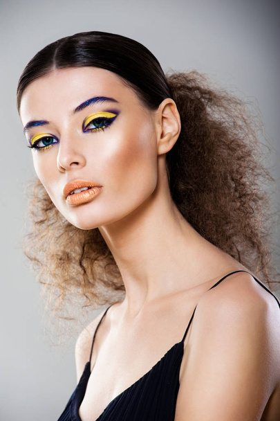 stylish young woman with beautiful make-up posing  - Fotografie, Obrázek
