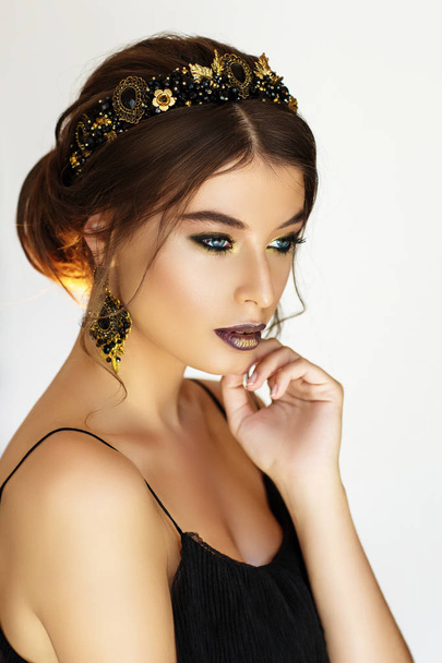 Portrait of gorgeous young woman in beautiful earrings  - Foto, imagen