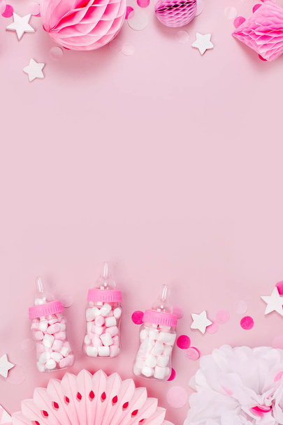Top view of frame made of pink and white paper decorations, candy, stars and confetti for baby party - Fotoğraf, Görsel