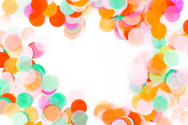 Close up of colorful round confetti on white background - Foto, afbeelding