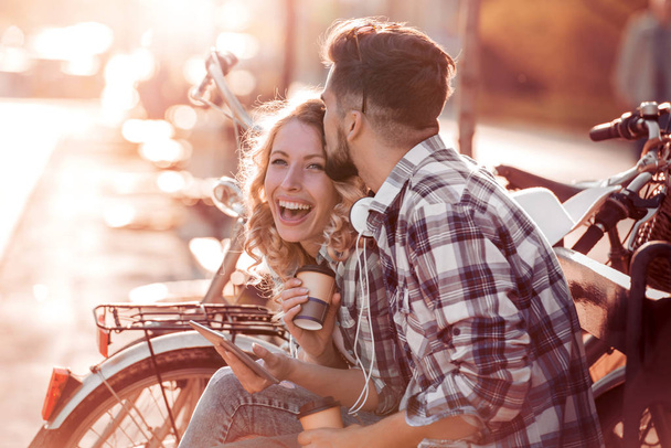Couple in love joking together on a bench  - Foto, immagini