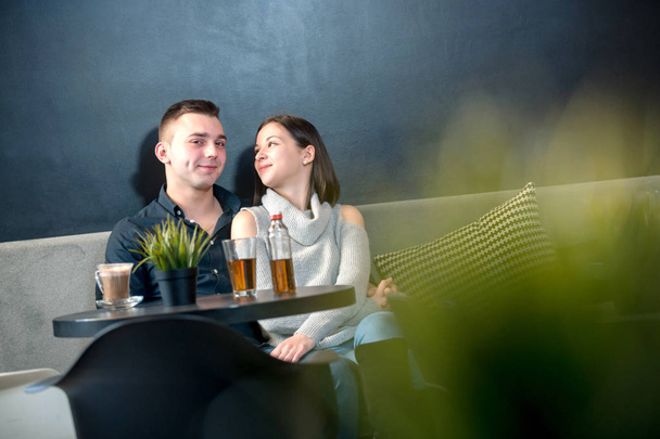 Young couple having fun at a caffe shop. - Fotografie, Obrázek