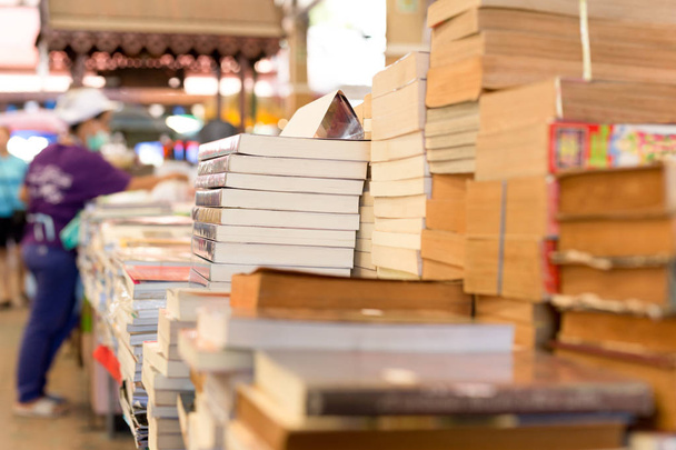 Piles of old books on a table  - 写真・画像