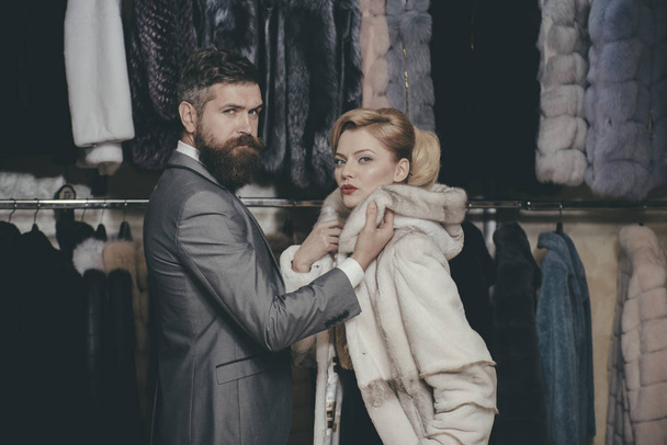 Customer with beard and woman buy furry coat. - Foto, Imagem
