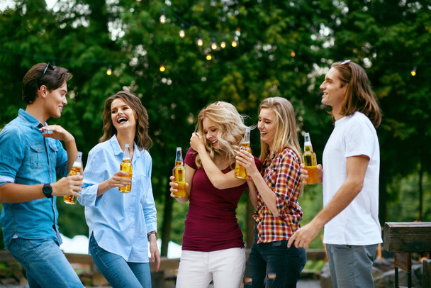 Party. Happy Friends Dancing And Drinking Outdoors. - Foto, Imagem
