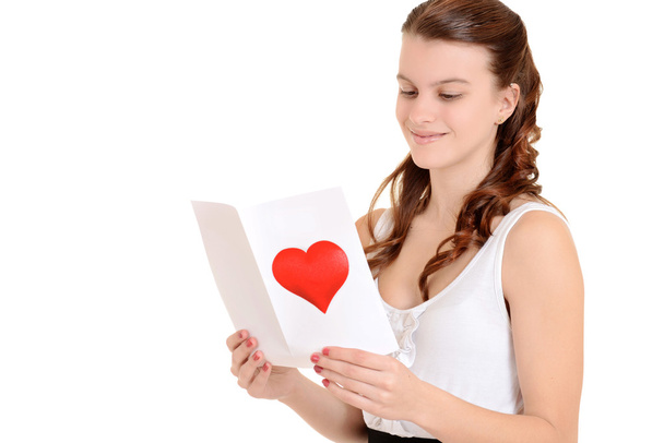 Teenager reading a valentines card - Foto, imagen