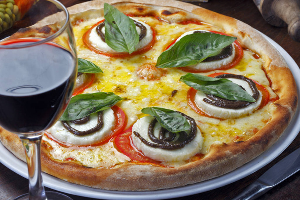 Pizza with burrata cheese and basil - 写真・画像