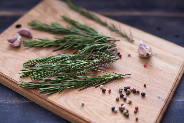 Rosemary plant on wooden rustic table from above, fresh organic herbs - 写真・画像