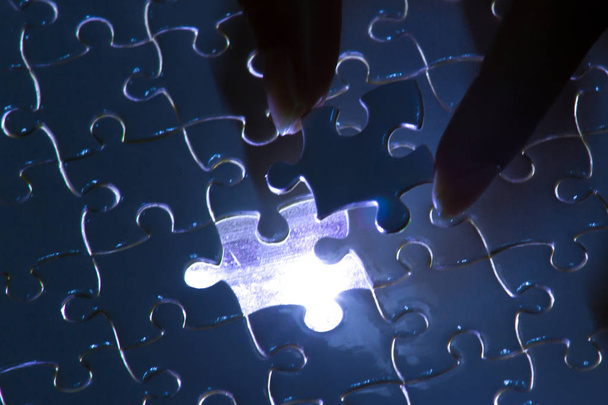 Missing jigsaw puzzle piece with light glow, business concept fo - Photo, Image