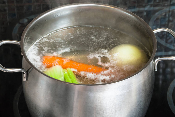 boiling meat broth in steel stockpot - Photo, Image