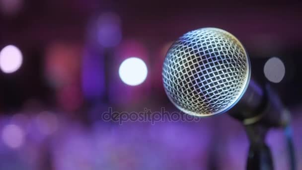 Microphone over the Abstract blurred conference hall or wedding banquet background - Footage, Video
