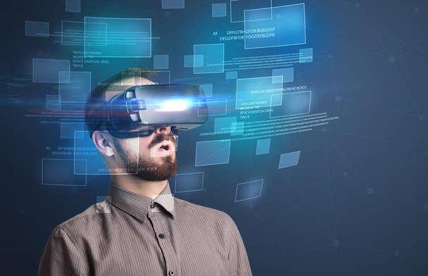 Businessman with virtual reality goggles - Foto, afbeelding
