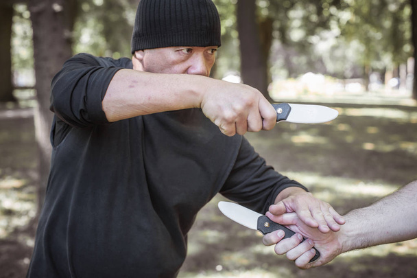 Lameco Astig Combatives. Knife vs knife self defense disarming t - Photo, Image