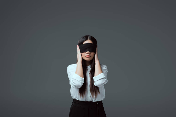 young blindfolded woman closing ears isolated on grey  - Fotoğraf, Görsel