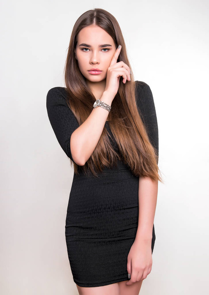 beautiful young woman with long hair wearing wrist watch - Valokuva, kuva