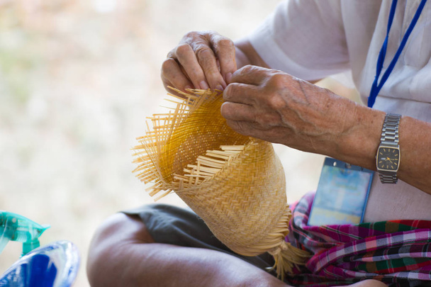 the villagers took bamboo stripes to weave into different forms for daily use utensils of the communitys people in Bangkok Thailand, Thai handmade product.   - Photo, Image