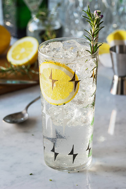 Rosemary Lemon Gin Fizz Cocktail, Herbal Drink on Marble Bar with Ingredients and Tools - Foto, Imagen