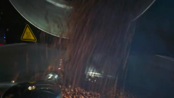 View of coffee beans strewing into roasting machine - Filmagem, Vídeo