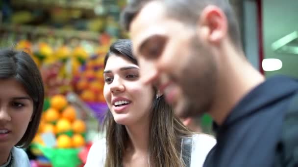 Friends hang out at fruit market (Mercadao) in Sao Paulo, Brazil - Footage, Video