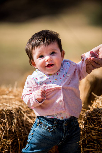 emotional portrait of a baby girl outdoors - Фото, зображення