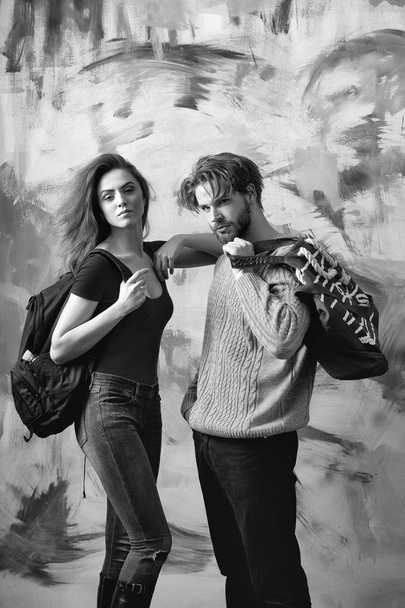 Pretty girl with backpack and bearded man with bag - Photo, Image