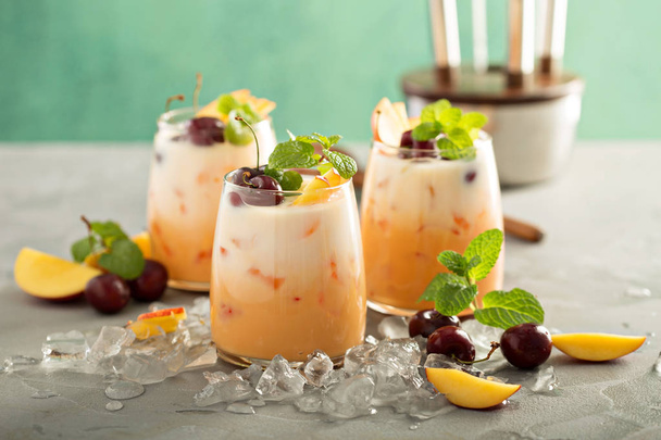 Summer cherry and peach coconut milk cocktail - Fotoğraf, Görsel