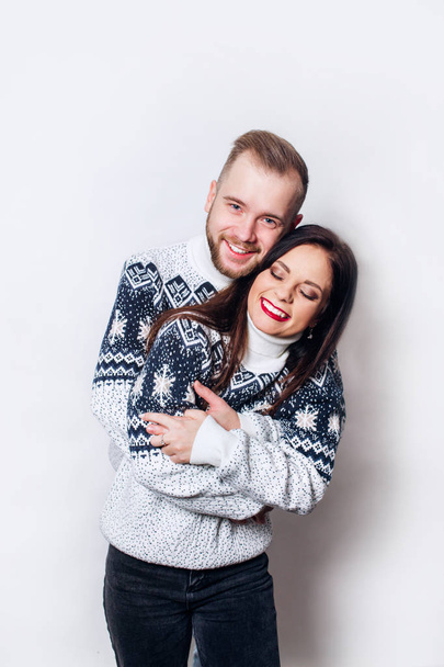 Loving winter couple on white background - Fotó, kép