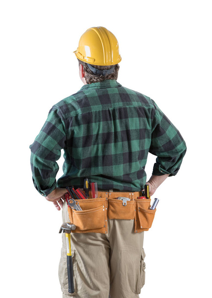 Male Contractor with Hard Hat and Tool Belt Looking Away Isolated on a White Background. - 写真・画像