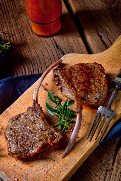 Grilled lamb chops on old board - Photo, Image