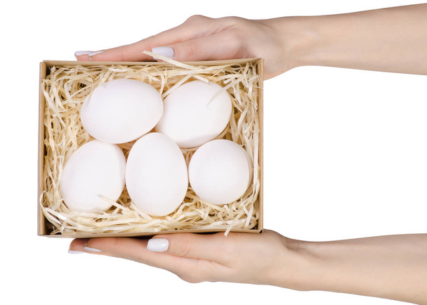 Chicken eggs in a basket box in hand - Fotografie, Obrázek
