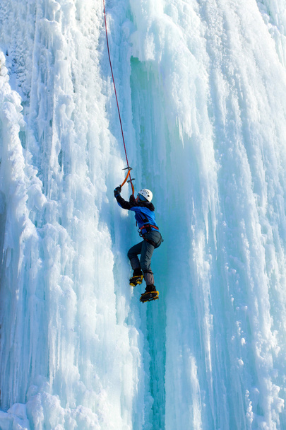 Ice climbing the waterfall. - Фото, зображення