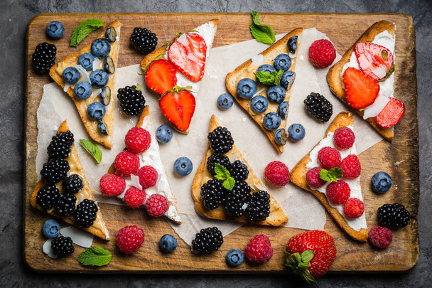 Selection of toasts with cheese peanut butter and berries - Foto, Imagem