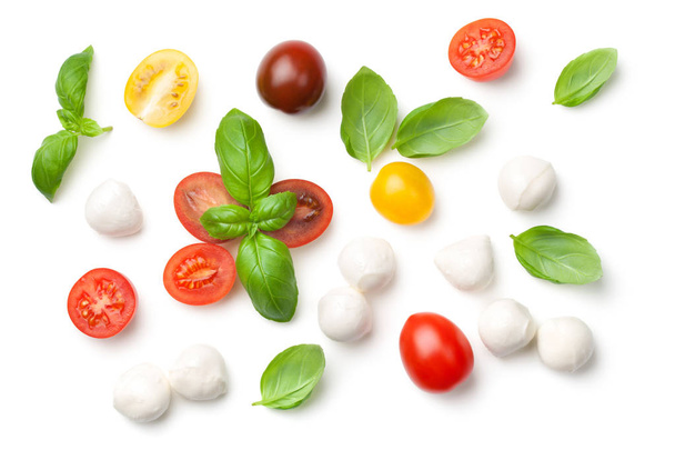Tomatoes, Basil and Mozzarella Isolated on White Background - Фото, изображение