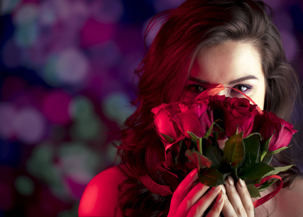 Valentines day oncept. Pretty girl on colorful bokeh background. - Photo, image