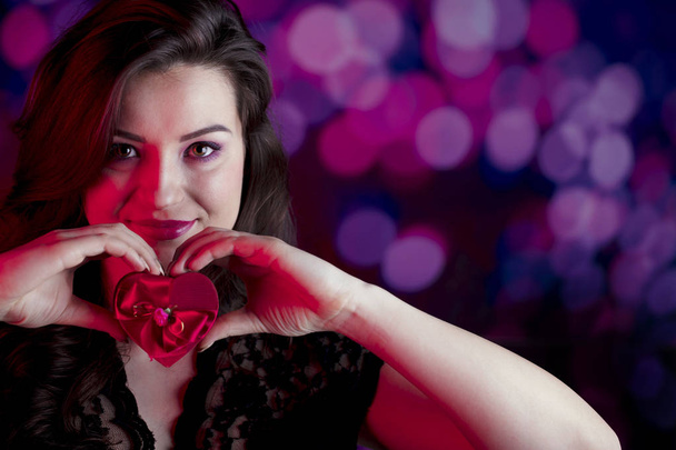 Valentines day oncept. Pretty girl on colorful bokeh background. - Фото, изображение