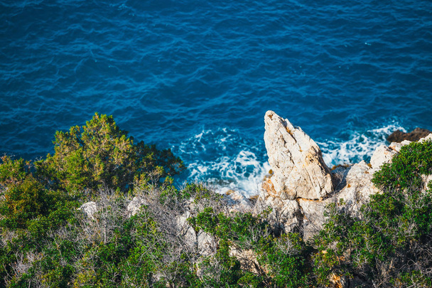 Rocky coast near Agios Nikolaos on Crete, Greece - Fotoğraf, Görsel