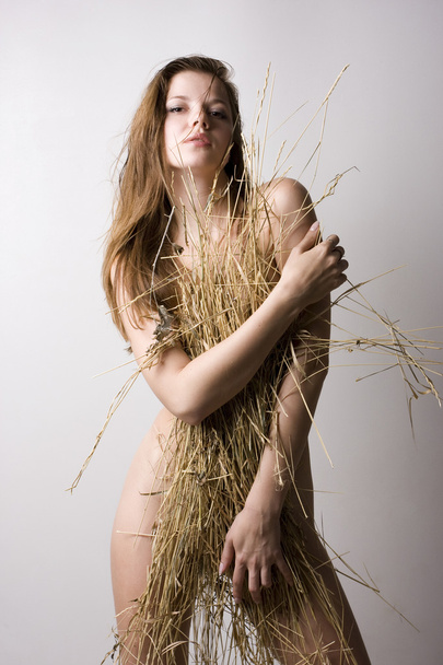 Woman and straw wisp - Photo, Image