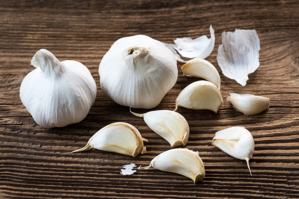 Garlic bulbs. Fresh garlic on the wooden table.  - Photo, Image