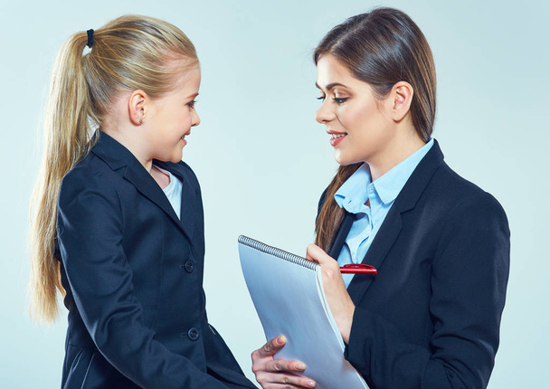 teacher in business suit speaking with pupil, education concept - Photo, Image