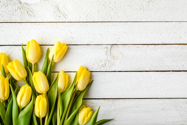 Yellow tulips, spring easter background or anniversary gift for mothers day or card for women's day at 8 march - Fotoğraf, Görsel