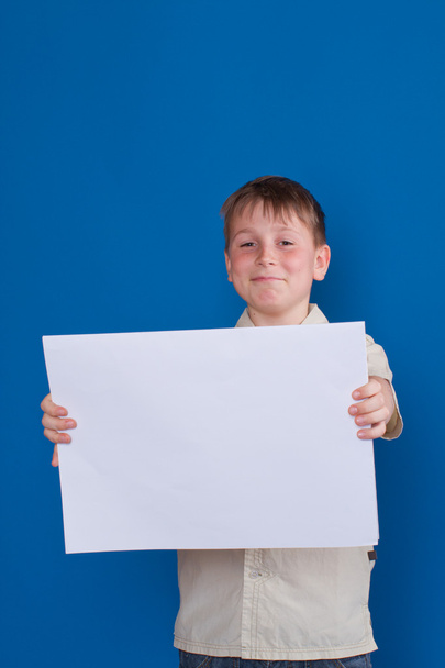 boy holding a blank - Φωτογραφία, εικόνα
