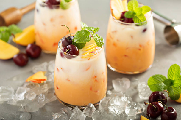 Summer cherry and peach coconut milk cocktail - Photo, image