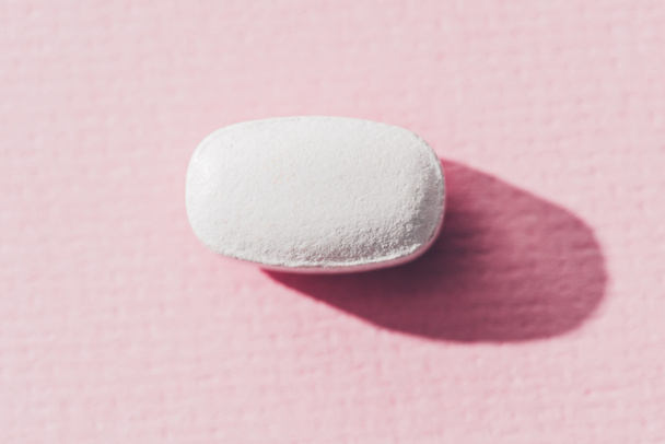 close up view of medicine on pink surface - Φωτογραφία, εικόνα