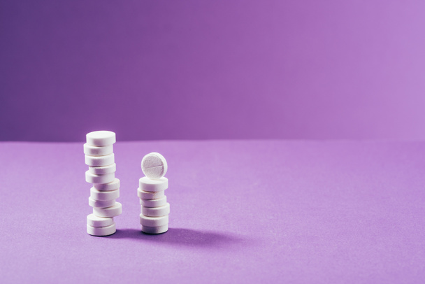 close up view of arranged pills on purple background  - Photo, Image