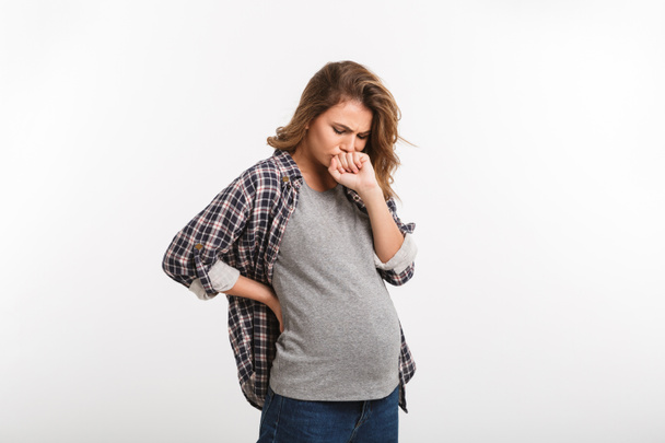 ritratto di donna incinta con nausea isolata su grigio
 - Foto, immagini