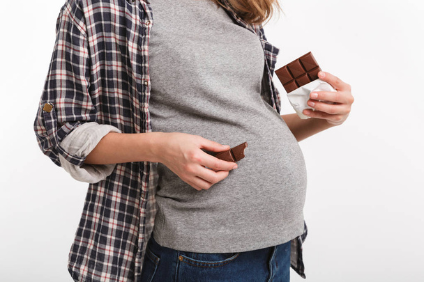 chocolate near belly - Foto, afbeelding