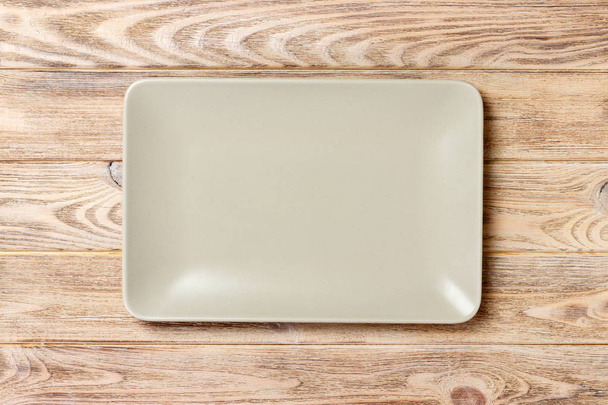 empty rectangular Plate on wooden table background - Photo, image
