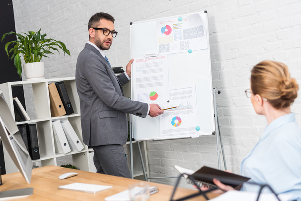 businessman making presentation with whiteboard for colleague at office - Photo, Image